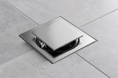 Ralo escamoteável quadrado cromado embutido no piso